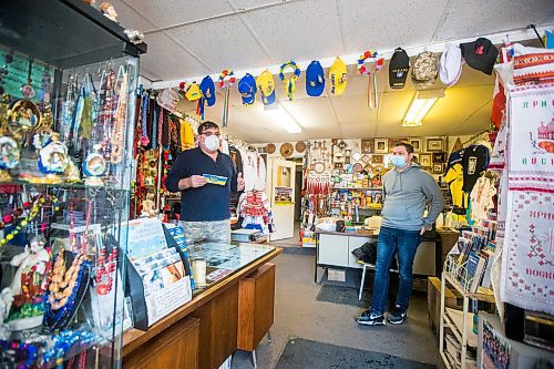 MIKAELA MACKENZIE / WINNIPEG FREE PRESS

Svitoch Ukrainian Export &amp; Import owner Ruslan Zeleniuk (left) and patron Alexey, who has family in the Luhansk region, talk to the Free Press in Winnipeg on Thursday, Feb. 24, 2022. For Erik story.
Winnipeg Free Press 2022.