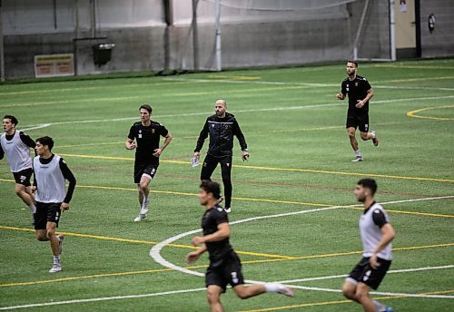 JESSICA LEE / WINNIPEG FREE PRESS

Coach Phillip Dos Santos (in jacket) is photographed during Valour FC soccer practice on March 8, 2022 at Winnipeg Soccer Federation South.

Reporter: Taylor

