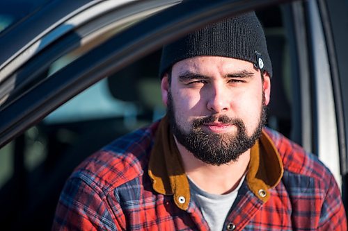 MIKAELA MACKENZIE / WINNIPEG FREE PRESS

Brett Parkin, who hasn&#x2019;t driven for SkipTheDishes for three weeks because of gas prices, poses for a portrait with his car in Winnipeg on Wednesday, March 9, 2022. For Gabby story.
Winnipeg Free Press 2022.