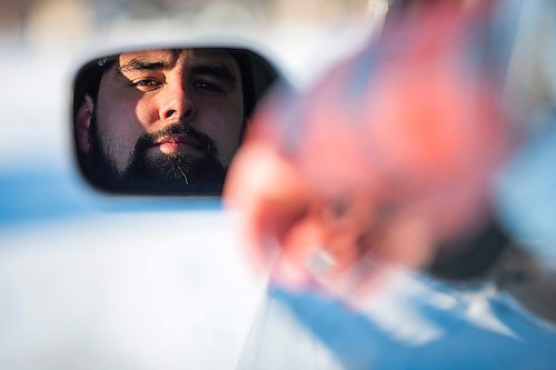 MIKAELA MACKENZIE / WINNIPEG FREE PRESS

Brett Parkin, who hasn&#x2019;t driven for SkipTheDishes for three weeks because of gas prices, poses for a portrait with his car in Winnipeg on Wednesday, March 9, 2022. For Gabby story.
Winnipeg Free Press 2022.