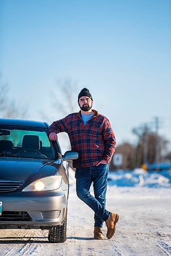 MIKAELA MACKENZIE / WINNIPEG FREE PRESS

Brett Parkin, who hasn&#x2019;t driven for SkipTheDishes for three weeks because of gas prices, poses for a portrait with his car in Winnipeg on Wednesday, March 9, 2022. For Gabby story.
Winnipeg Free Press 2022.