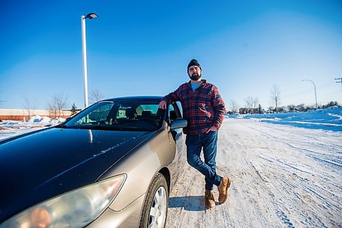 MIKAELA MACKENZIE / WINNIPEG FREE PRESS

Brett Parkin, who hasn&#x2019;t driven for SkipTheDishes for three weeks because of gas prices, poses for a portrait with his car in Winnipeg on Wednesday, March 9, 2022. For Gabby story.
Winnipeg Free Press 2022.