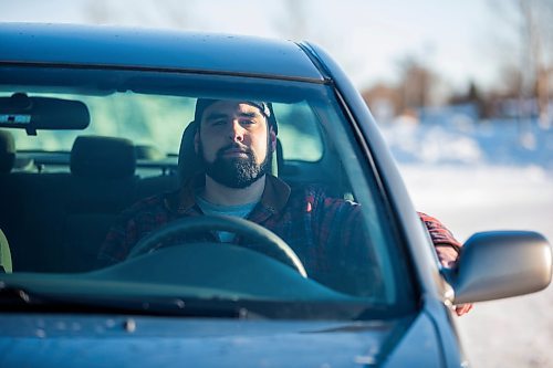 MIKAELA MACKENZIE / WINNIPEG FREE PRESS

Brett Parkin, who hasn&#x2019;t driven for SkipTheDishes for three weeks because of gas prices, poses for a portrait with his car in Winnipeg on Wednesday, March 9, 2022. For Gabby story.
Winnipeg Free Press 2022.