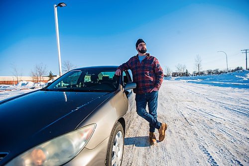 MIKAELA MACKENZIE / WINNIPEG FREE PRESS

Brett Parkin, who hasn&#x2019;t driven for SkipTheDishes for three weeks because of gas prices, poses for a portrait with his car in Winnipeg on Wednesday, March 9, 2022. For Gabby story.
Winnipeg Free Press 2022.