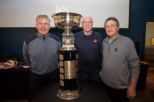 MIKE DEAL / WINNIPEG FREE PRESS
(from left) AVCO Cup champions; Perry Miller, Mike Ford, and Bill Lesuk with the AVCO Cup during the announcement at the BellMTS Iceplex, for the upcoming 50th Anniversary of the WHA.
See Taylor Allen story
220310 - Thursday, March 10, 2022.