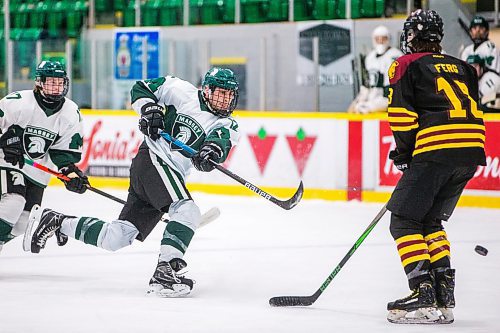 MIKAELA MACKENZIE / WINNIPEG FREE PRESS

Vincent Massey Trojan Matthew Peltz shoots the puck during a Manitoba AAAA high school boys hockey championship game in Selkirk on Friday, March 11, 2022. Standup.
Winnipeg Free Press 2022.