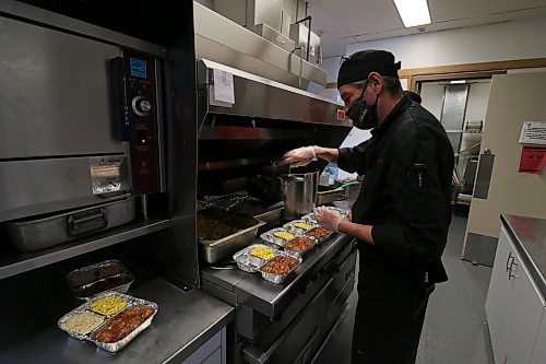 Staff at the Prairie Oasis Senior Centre prepare dozens of meals ready for delivery in conjunction with Everybody Eats Brandon. Nearly 250 meals were cooked and sent out on Friday Mar. 11. (Joseph Bernacki/The Brandon Sun)