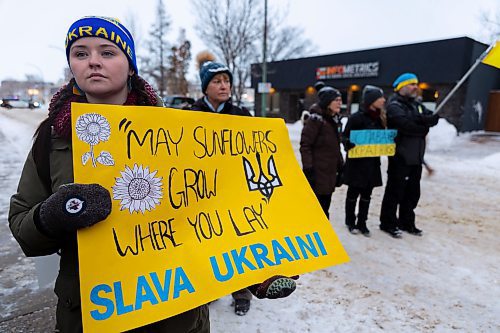 Megan Luhowy holds a sign in support of Ukraine Saturday at Brandon City Hall. (Chelsea Kemp/The Brandon Sun)