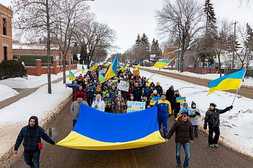 Brandonites march in support of Ukraine down 18th street Saturday. The rally saw hundreds meet at Brandon University and make their way to Brandon City Hall. (Chelsea Kemp/The Brandon Sun)