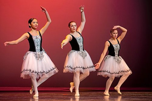 SPARKLE MOTION: Madelyn Albert, left, Alyx Doyle and Xylia Crossman perform in the ballet session of the Steppin&#x560;Time Dance Studios 2022 Showcase. The Showcase takes place over four days and features more than 200 performances in front of a live audience for the first time in two years. The next session will take place on Thursday and features stage dance and jazz. On Friday the showcase will feature tap dancing and the event concludes Saturday with a ballet, pointe, lyrical, modern, acro and hip hop performances. (Chelsea Kemp/The Brandon Sun)