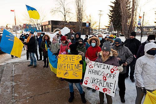 Community members gather in front of Brandon City Hall Friday in support of Ukraine. The country was invaded by Russian forces Thursday. (Chelsea Kemp/The Brandon Sun)