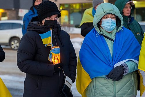 Community members gather in front of Brandon City Hall Friday in support of Ukraine. The country was invaded by Russian forces Thursday. (Chelsea Kemp/The Brandon Sun)