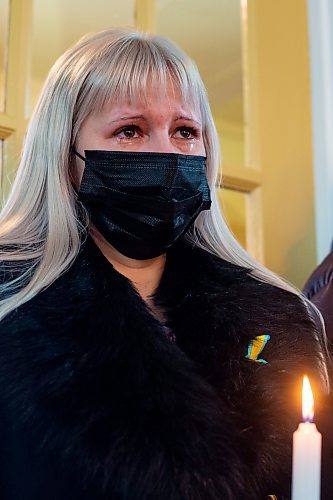 Nadiia Khomenko holds a candle at the Holy Ghost Ukrainian Orthodox Church during a prayer service in support of Ukraine Sunday. In response to the Russian invasion of the country the Ukrainian Orthodox Church of Canada has blessed all churches to be active centres of prayer and &#x4a8;avens for the storm-tossed&#x4e0;to provide solace to communities. (Chelsea Kemp/The Brandon Sun)