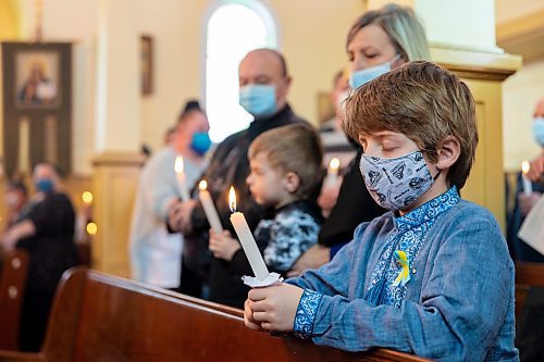 Victor Samotiy, 7, attends the Holy Ghost Ukrainian Orthodox Church prayer service in support of Ukraine Sunday. In response to the Russian invasion of the country the Ukrainian Orthodox Church of Canada has blessed all churches to be active centres of prayer and &#x4a8;avens for the storm-tossed&#x4e0;to provide solace to communities. (Chelsea Kemp/The Brandon Sun)