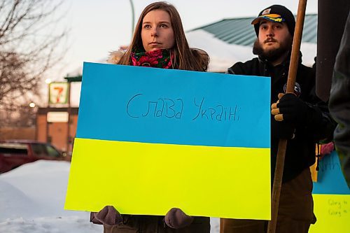Community members gather for the Stand with Ukraine Rally in front of Dauphin City Hall Wednesday.(Chelsea Kemp/The Brandon Sun)