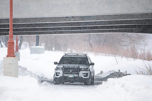 Daniel Crump / Winnipeg Free Press. A police vehicle sits underneath the Esplanade Riel near the spot where a body was discovered Saturday morning. March 12, 2022.