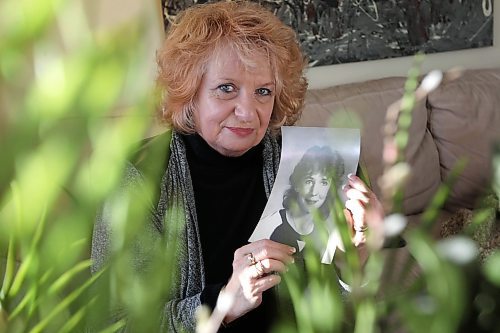 Wilma Derksen is at peace as she sits in the late afternoon sunlight shining through her living room window while holding a black &amp; white photograph of her slain daughter Candace.  Her and her husband Cliff remain convinced that Mark Edward Grant is responsible for their daughter's 1984 abduction and murder but understand why the man is happy he's been awarded a new trial.  See story.  Thursday,  March 05, 2015 Ruth Bonneville / Winnipeg Free Press.