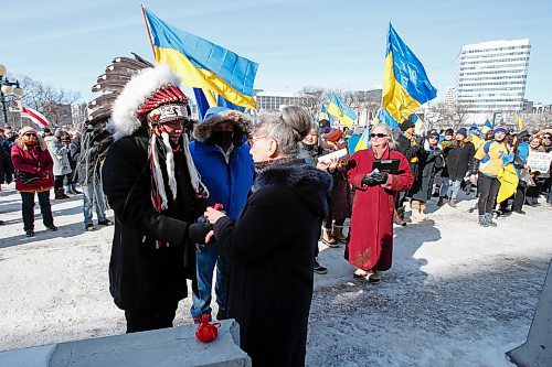 JOHN WOODS / WINNIPEG FREE PRESS
Chief Garrison Settee receives tobacco from Joanne Lewandosky, President of the Ukrainian Canadian Congress, as people gather at a rally in support of Ukraine and against the Russian invasion at the Manitoba Legislature Sunday, March 13, 2022.