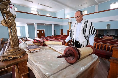 RUTH BONNEVILLE / WINNIPEG FREE PRESS

FAITH - synagogue / museum

Dr. Gerald Minuk, spreads open one of the scrolls from the Torah at the orthodox  Ashkenazie Synagogue located at 297 Burrows Ave. Monday.  

Dr. Gerald Minuk a volunteer chair of the Ashkenazie&#x573; centennial committee, was involvement with turning the orthodox  Ashkenazie Synagogue located at 297 Burrows Ave  into a synagogue-museum.  

More info on this scroll.  The writing on this page of the Torah s God speaking to Moses to lead His people to freedom from the Pharaoh in Egypt. The Torah is hand-written in Hebrew with a quill on specially prepared parchment and sewn together with sinews to form one long scroll.


March 14th,  2022
