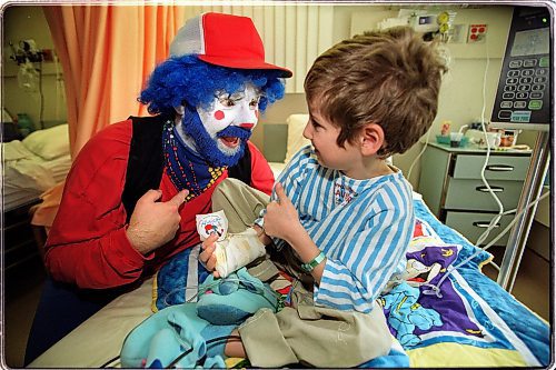 Photo by Ruth Bonneville/Winnipeg Free Press Work Faces-David Langdon is a Therapeutic Clown and works under the name of &quot;Hubert&quot; at The Childrens Hospital.  Five year old Sergio Scaramuzzi enjoys the funloving entertainment during his hospital stay over the holidays.