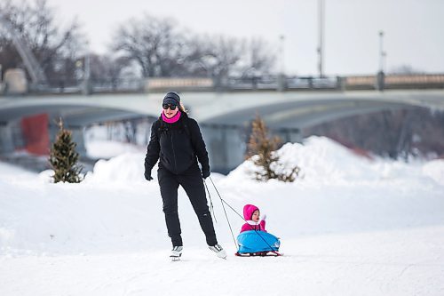 MIKAELA MACKENZIE / WINNIPEG FREE PRESS

Twila Fillion pulls her daughter, Raphalle Fillion (two), on an open section of the River Trail at The Forks, which is now closed from Queen Elizabeth Way to Churchill Drive, in Winnipeg on Tuesday, March 15, 2022. Standup.
Winnipeg Free Press 2022.
