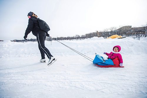 MIKAELA MACKENZIE / WINNIPEG FREE PRESS

Twila Fillion pulls her daughter, Raphalle Fillion (two), on an open section of the River Trail at The Forks, which is now closed from Queen Elizabeth Way to Churchill Drive, in Winnipeg on Tuesday, March 15, 2022. Standup.
Winnipeg Free Press 2022.