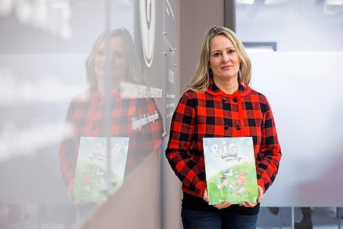 MIKAELA MACKENZIE / WINNIPEG FREE PRESS

Noni Classen, director of education for the Canadian Centre of Child Protection, poses for a portrait with a book that they've translated into Ukrainian to distribute to kids affected by the war on Tuesday, March 15, 2022. For Katie May story.
Winnipeg Free Press 2022.