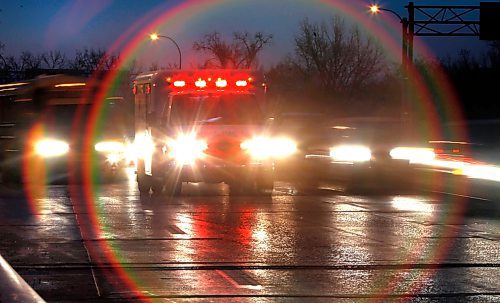 Ambulance on St. Vital Bridge.    (WAYNE GLOWACKI/WINNIPEG FREE PRESS) Winnipeg Free Press Nov.2 2011