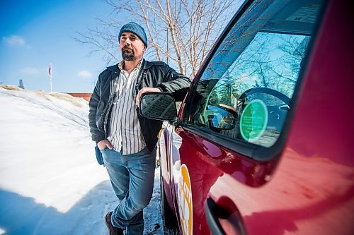 MIKAELA MACKENZIE / WINNIPEG FREE PRESS

William Belford, fleet manager for Peg City Car Co-op, poses for a portrait with the truck that had gas siphoned out of the tank in Winnipeg on Wednesday, March 16, 2022. For Erik story.
Winnipeg Free Press 2022.