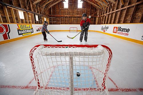 MIKE DEAL / WINNIPEG FREE PRESS
Matt (left) and Sam Rawlings (right) on the rink.
Dave Rawlings converted a barn on his property, with the help of his father Eric, into an indoor mini-skating rink. Including a heated change room. When the pandemic hit his kids, Sam and Matt, were able to skate almost everyday even during the worst lockdown stages.
See Ben Waldman story
220316 - Wednesday, March 16, 2022.