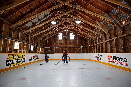 MIKE DEAL / WINNIPEG FREE PRESS
Matt (left) and Sam Rawlings (right) on the rink.
Dave Rawlings converted a barn on his property, with the help of his father Eric, into an indoor mini-skating rink. Including a heated change room. When the pandemic hit his kids, Sam and Matt, were able to skate almost everyday even during the worst lockdown stages.
See Ben Waldman story
220316 - Wednesday, March 16, 2022.
