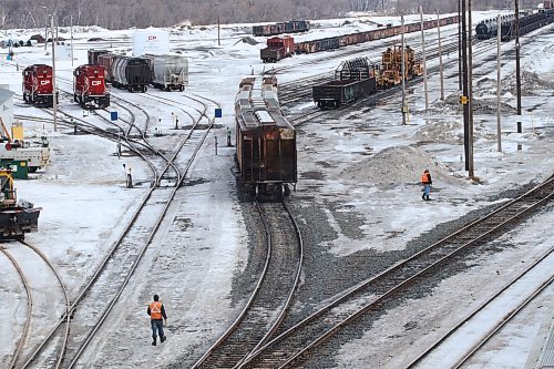 CP Rail workers survey the railyards beneath the 1st Street Bridge. The Teamsters Canada Union representing up to 3,000 CP employees is continuing to negotiate with the company who has issued a notice of lockout for Mar. 20 at 12:01 a.m. (Joseph Bernacki/The Brandon Sun)