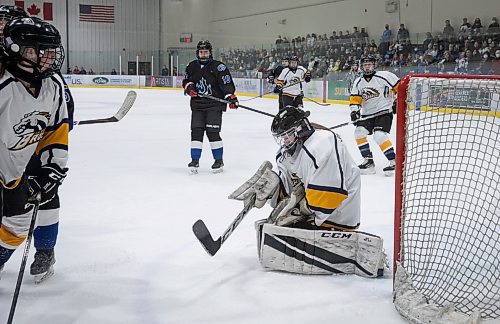 JESSICA LEE / WINNIPEG FREE PRESS

J.H. Bruns player Katrina Johnston (1) stops the puck from going into the net. Coll&#xe8;ge Jeanne-Sauv&#xe9; (wearing black) won the women&#x2019;s high school hockey championship against J.H. Bruns (3-0) on March 17, 2022 during the third finals game. 

Reporter: Taylor


