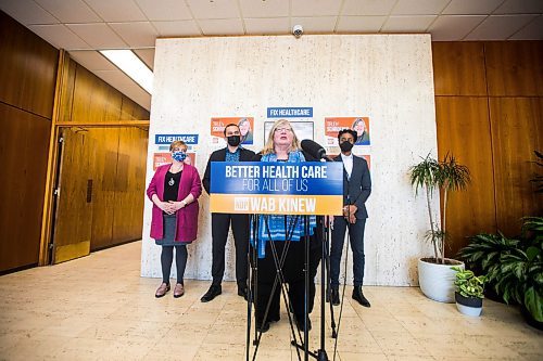 MIKAELA MACKENZIE / WINNIPEG FREE PRESS

NDP Fort Whyte candidate Trudy Schroeder speaks about health care cuts as NDP MLA Lisa Naylor (left), NDP Leader Wab Kinew, and NDP MLA Uzoma Asagwara listen at the NDP Fort Whyte campaign office in Winnipeg on Friday, March 18, 2022.  For Danielle Da Silva story.
Winnipeg Free Press 2022.