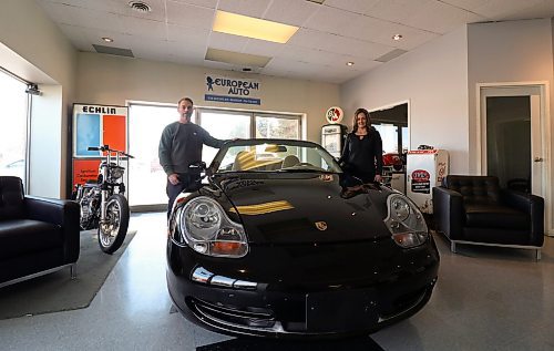 Jeff Brown, general manager of European Auto (Imports) (left), and his wife Tanya said busy has been consistently steady over the past two years. Seen here with a 2002 Porsche 911 Carrera, the couple said the number of European imports found on Brandon streets has really picked up since the pandemic began. (Joseph Bernacki/The Brandon Sun)