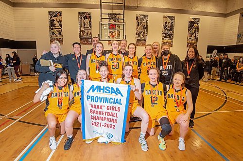 Mike Sudoma / Winnipeg Free Press
The Dakota Lancers Varsity Women&#x2019;s Basketball team pose with their Farmers of Manitoba Provincial AAAA Girls Basketball Championship Banner after their provincial win against the Westwood Warriors at Maples Collegiate Saturday afternoon
March 19, 2022
