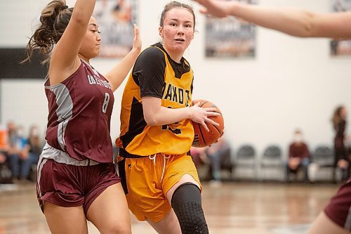 Mike Sudoma / Winnipeg Free Press
Dakota Lancers, Izzy Fust, makes her way down the court past Westwood Warriors, Delaney Galera as the two teams battle for the Farmers of Manitoba Provincial AAAA Girls Basketball Championship banner at Maples Collegiate Saturday afternoon
March 19, 2022