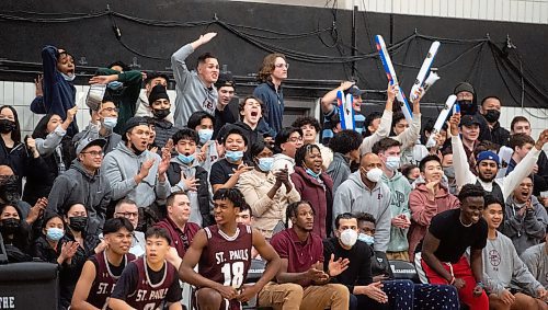 Mike Sudoma / Winnipeg Free Press
St Pauls Crusaders fans and team cheer on their team off the court as they take on the John Taylor Pipers for the Manitoba Dairy Farmers Provincial AAAA Boys Basketball Championships at Maples Collegiate Saturday afternoon
March 19, 2022