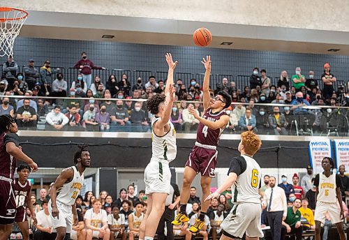 Mike Sudoma / Winnipeg Free Press
St Pauls Crusaders, Lorence deal Cruz shoots the ball over John Taylor Pipers&#x2019; defence, resulting in a basket during Saturday evenings Provincial AAAA Boys Basketball Championship game at Maples Collegiate Saturday afternoon
March 19, 2022