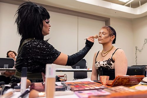 Local drag performer Flora Hex shows how to create a drag persona with Koda Maxon during a workshop at the Art Gallery of Southwestern Manitoba Saturday. (Chelsea Kemp/The Brandon Sun)