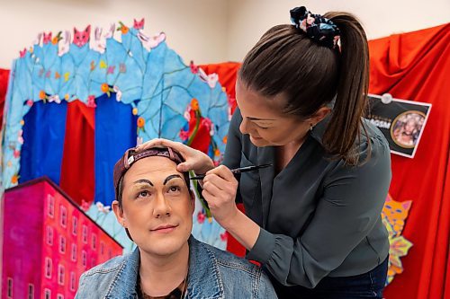 Cory Kukurudz, left, has Kelly DeRoo apply makeup during a drag workshop at the Art Gallery of Southwestern Manitoba led by local performer Flora Hex Saturday. (Chelsea Kemp/The Brandon Sun)