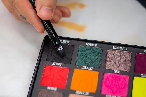 Cory Kukurudz selects an eyeshadow shade during a drag workshop at the Art Gallery of Southwestern Manitoba Saturday. (Chelsea Kemp/The Brandon Sun)