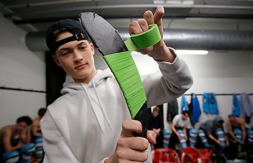 JOHN WOODS / WINNIPEG FREE PRESS
Easton Kapelus of the Lorette Scorpions, who is playing on  Winnipeg High School Hockey League (WHSHL) All-star team blue, tapes his stick in green in support of the Canadian Transplant Association&#x573; Green Shirt Day organ donor initiative in honour of the Logan Boulet Foundation at the Gateway arena in Winnipeg, Sunday, March 20, 2022. 