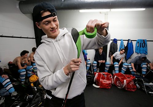 JOHN WOODS / WINNIPEG FREE PRESS
Easton Kapelus of the Lorette Scorpions, who is playing on  Winnipeg High School Hockey League (WHSHL) All-star team blue, tapes his stick in green in support of the Canadian Transplant Association&#x573; Green Shirt Day organ donor initiative in honour of the Logan Boulet Foundation at the Gateway arena in Winnipeg, Sunday, March 20, 2022. 