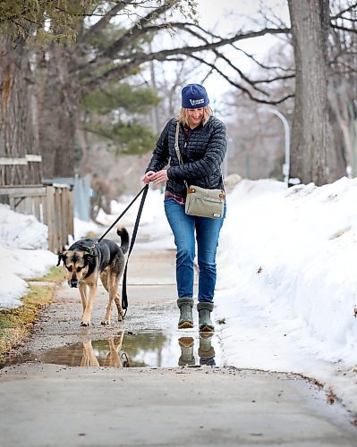RUTH BONNEVILLE / WINNIPEG FREE PRESS

Standup - Spring dog walk 

Lisa Holochuck encounters mountains of snow, puddles and even a little grass poking through some lawns while out waking her dog Banjo in St. Boniface on the first day of spring Monday.  

March 21st,  2022
