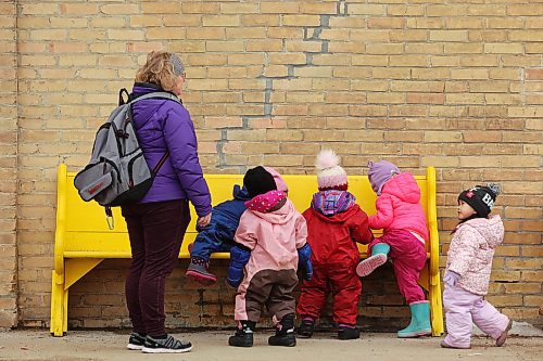 22032022
Laura Remillard with Souris Cooperative Daycare leads a colourful group of kids on a walk through Souris on Tuesday morning.  (Tim Smith/The Brandon Sun)