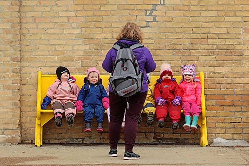 22032022
Laura Remillard with Souris Cooperative Daycare leads a colourful group of kids on a walk through Souris on Tuesday morning.  (Tim Smith/The Brandon Sun)