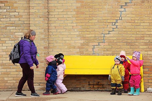 22032022
Laura Remillard with Souris Cooperative Daycare leads a colourful group of kids on a walk through Souris on Tuesday morning.  (Tim Smith/The Brandon Sun)