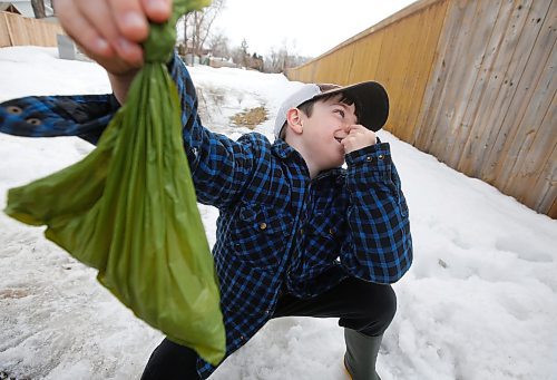 JOHN WOODS / WINNIPEG FREE PRESS
Jake Hultin carries a bag of his puppy Maui&#x2019;s poop as they go for a walk Tuesday, March 22, 2022. Nine year old Hutlin wrote a letter to the city after he noticed that Charleswood is lacking garbage cans for him to drop his doggie bags and litter while out for a walk. Hutlin is asking the city to put out more garbage cans.

Re: Joyanne