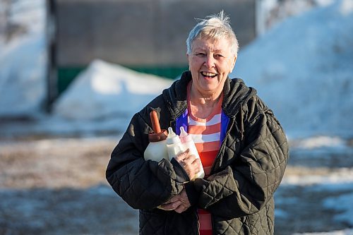 MIKAELA MACKENZIE / WINNIPEG FREE PRESS

Linda Frig walks out with an armful of milk to feed the bottle-fed lambs at their farm near Petersfield on Thursday, March 24, 2022.  Standup.
Winnipeg Free Press 2022.